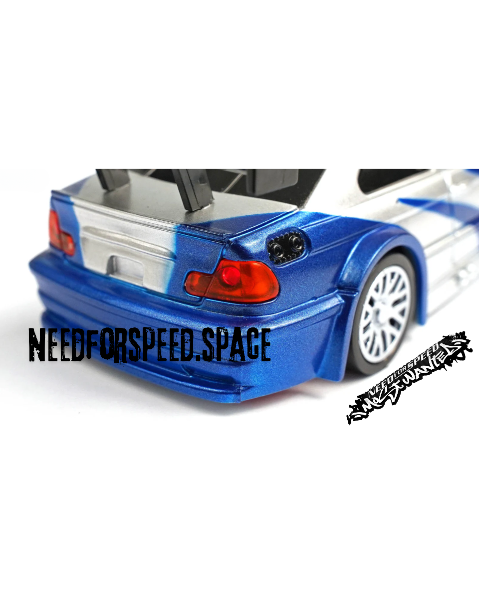 Detailed shot of BMW M3 E46 GTR RC car tires and suspension system